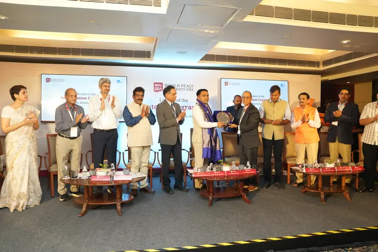 Dignitaries felicitated on the dais at the WPU GŌA Doctoral Programme launch