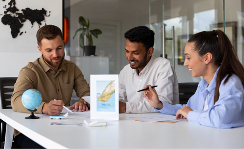 Three professionals collaborating at a table with a globe during a policy discussion