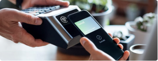 A contactless digital payment being made at a point-of-sale terminal in India