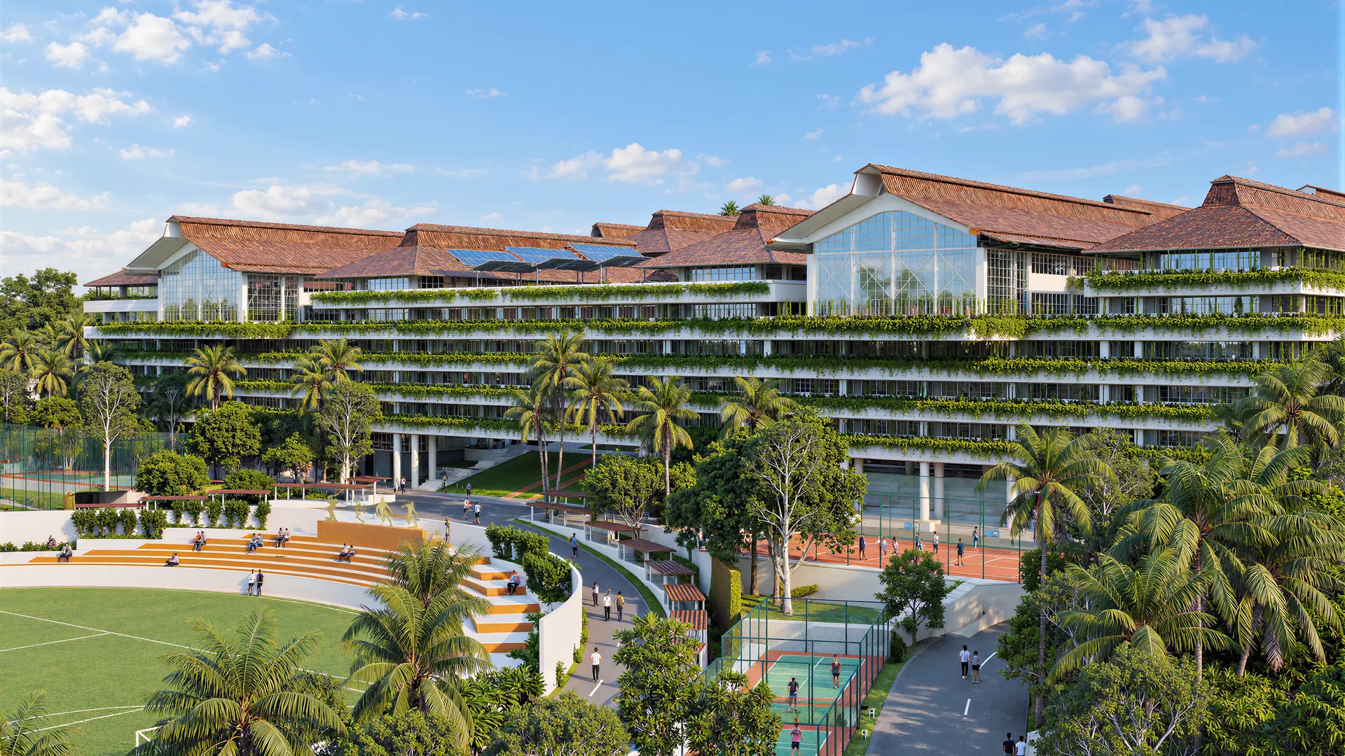 The WPU GŌA campus, with its terraced green buildings, sports courts and playing field